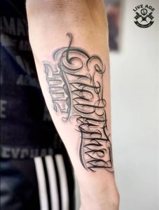 Arm Writing Name Tattoo Idea 