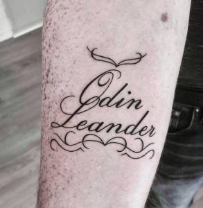 Man's Arm Writing Tattoo 