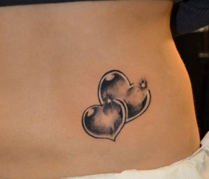 Double Heart Lower Back Spine Tattoo