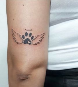 Memorial tattoo with wings