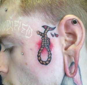 Noose tattoo behind ear