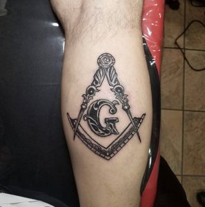 Freemason Leg Holding Tattoo 